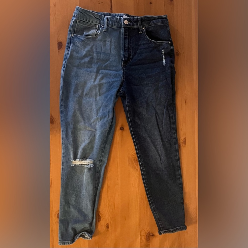 Two toned jeans with rips in right knee